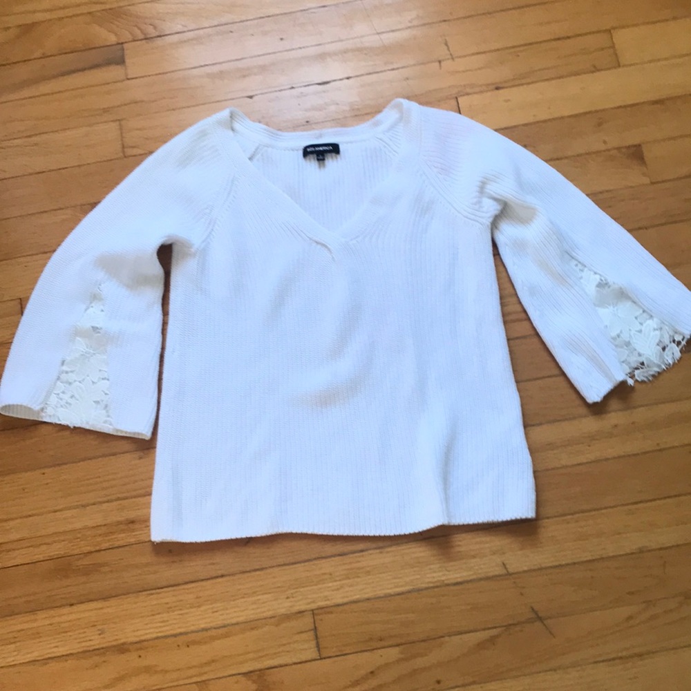 White sweater, v neck, full sleeves with a bit of lace 525 America brand. Small
